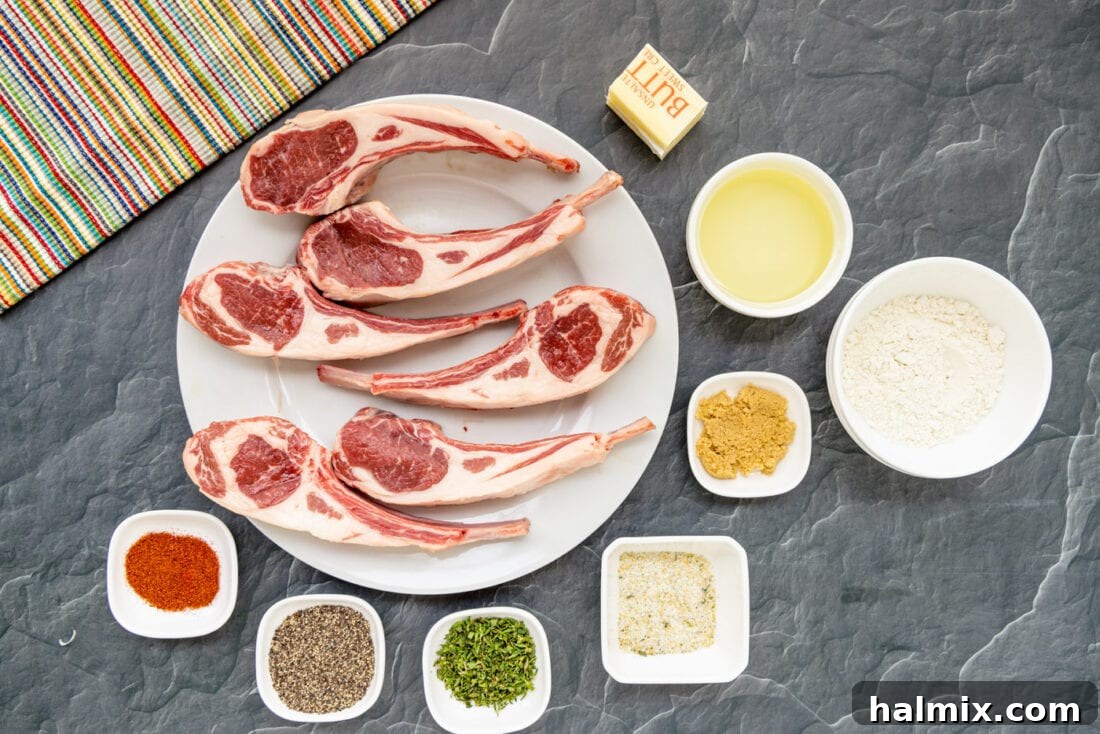 A selection of fresh ingredients laid out on a cutting board, including lamb chops, spices, flour, olive oil, butter, and fresh thyme, ready for making Lollipop Lamb Chops.