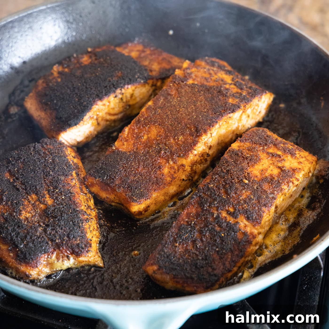 Cajun Seared Salmon 7 A close-up of pan-seared blackened salmon, showcasing its exquisite texture and spice crust.