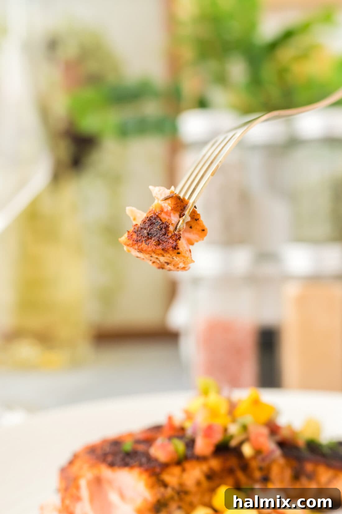 Cajun Seared Salmon 8 Close up of a fork with a piece of flaky Blackened Salmon, perfectly cooked.