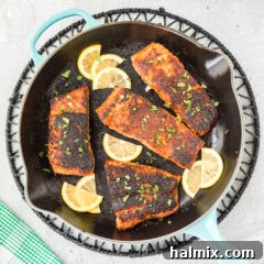 Cajun Seared Salmon 9 Blackened Salmon in a skillet, ready to be served.