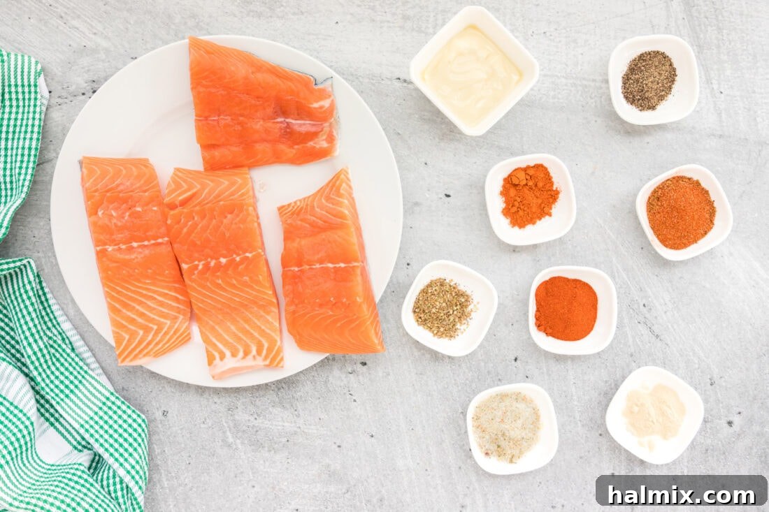 Cajun Seared Salmon 4 A collection of ingredients for Blackened Salmon, including salmon fillets, butter, and various spices.