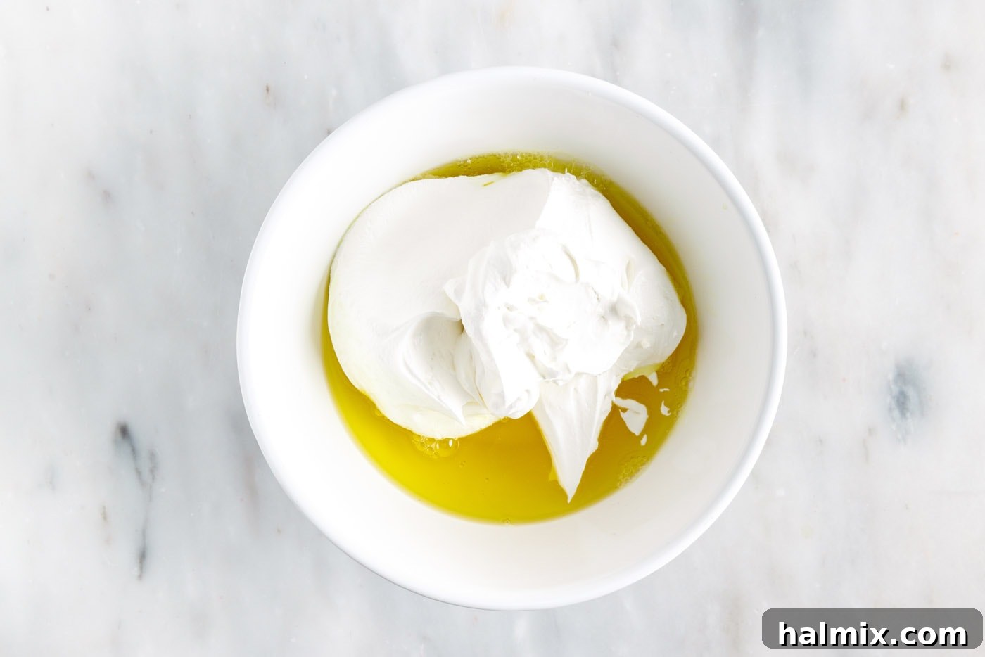 Rainbow Ripple Gelatin Pie 11 Gently folding lemon jello with whipped cream, creating the 'white' layer for the pie.