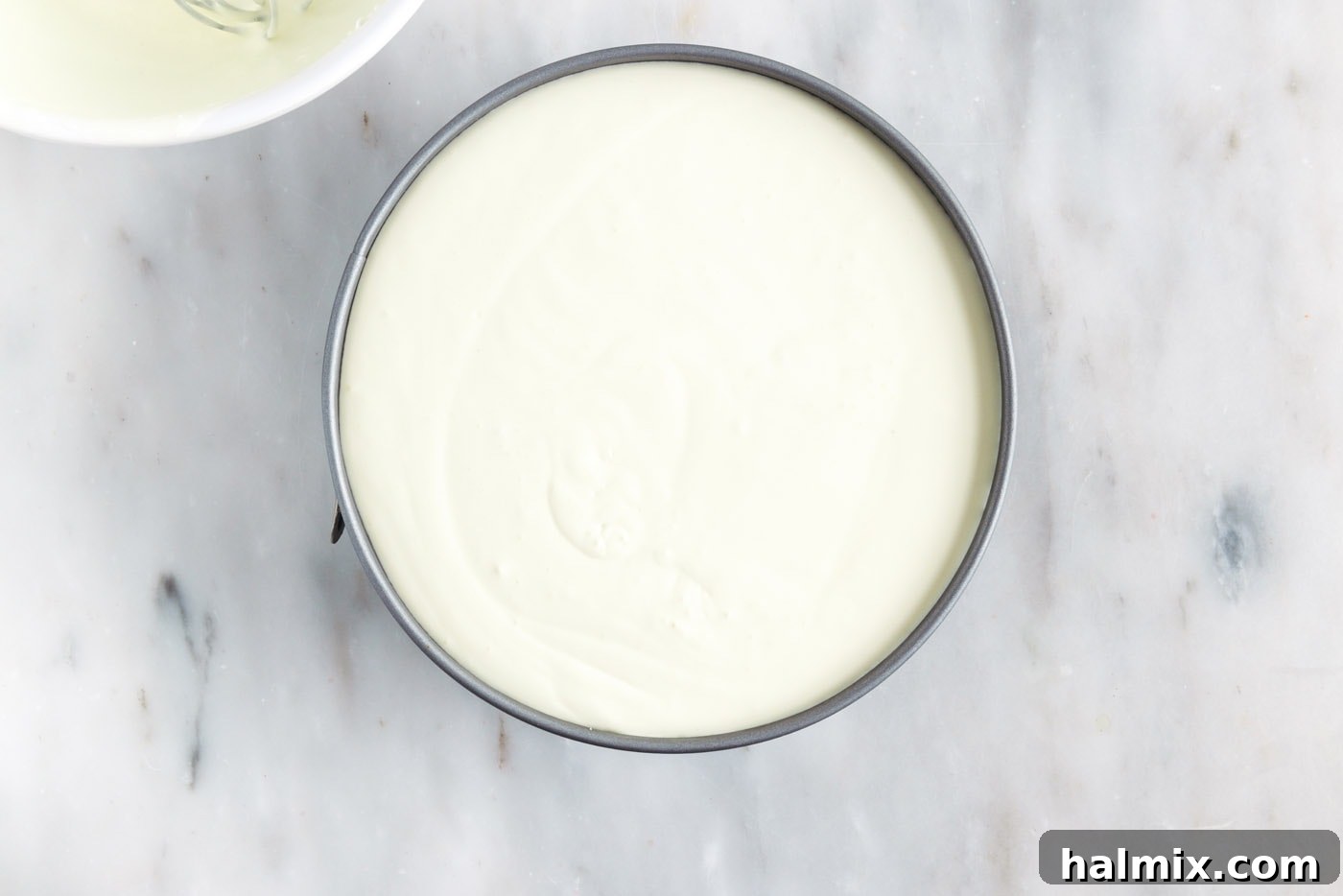 The second layer of whipped lemon jello mixture carefully spread over the set green layer in the springform pan.