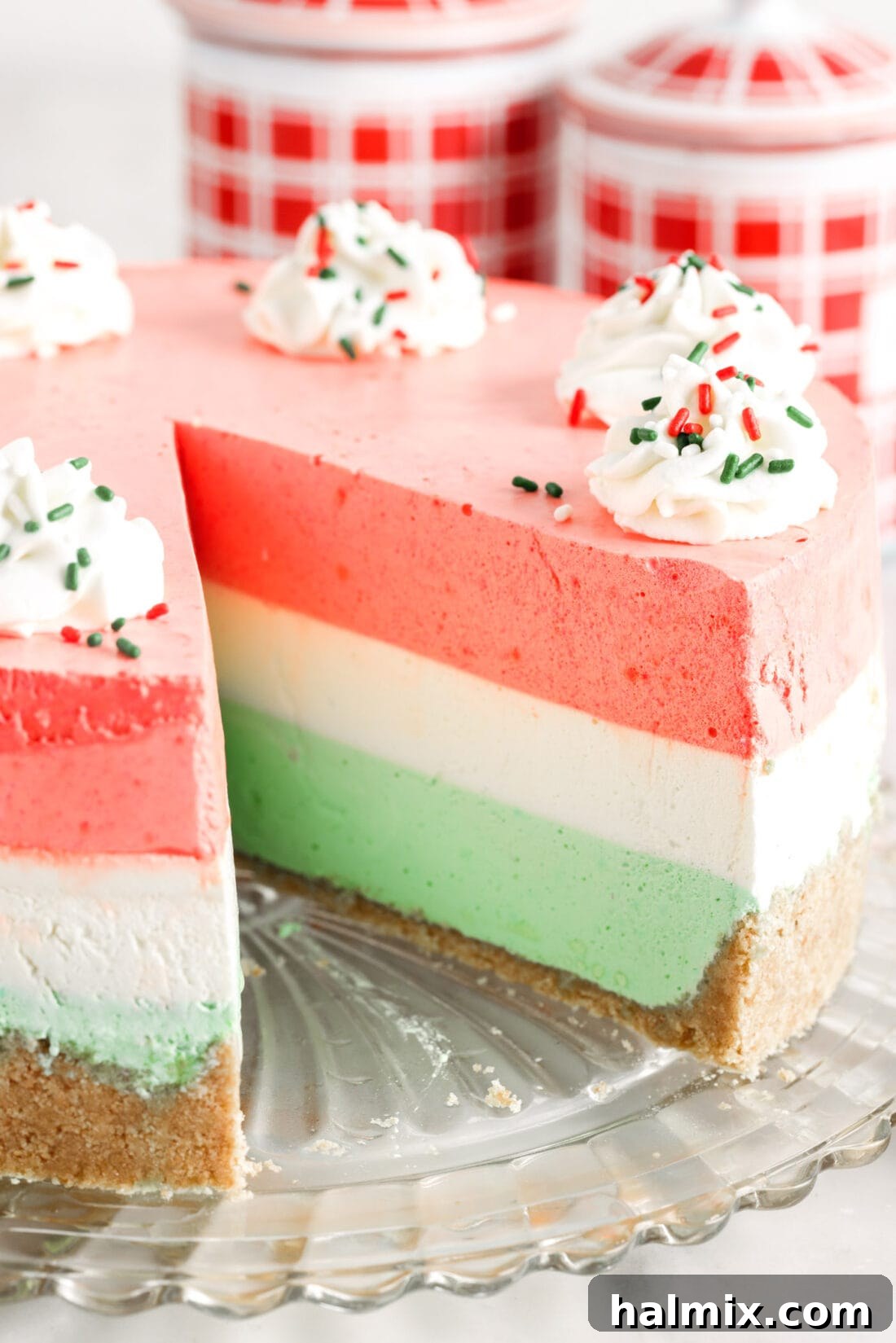 Rainbow Ripple Gelatin Pie 17 A slice removed from a Layered Jello Pie, showcasing the neat, vibrant layers and fluffy texture of the dessert.