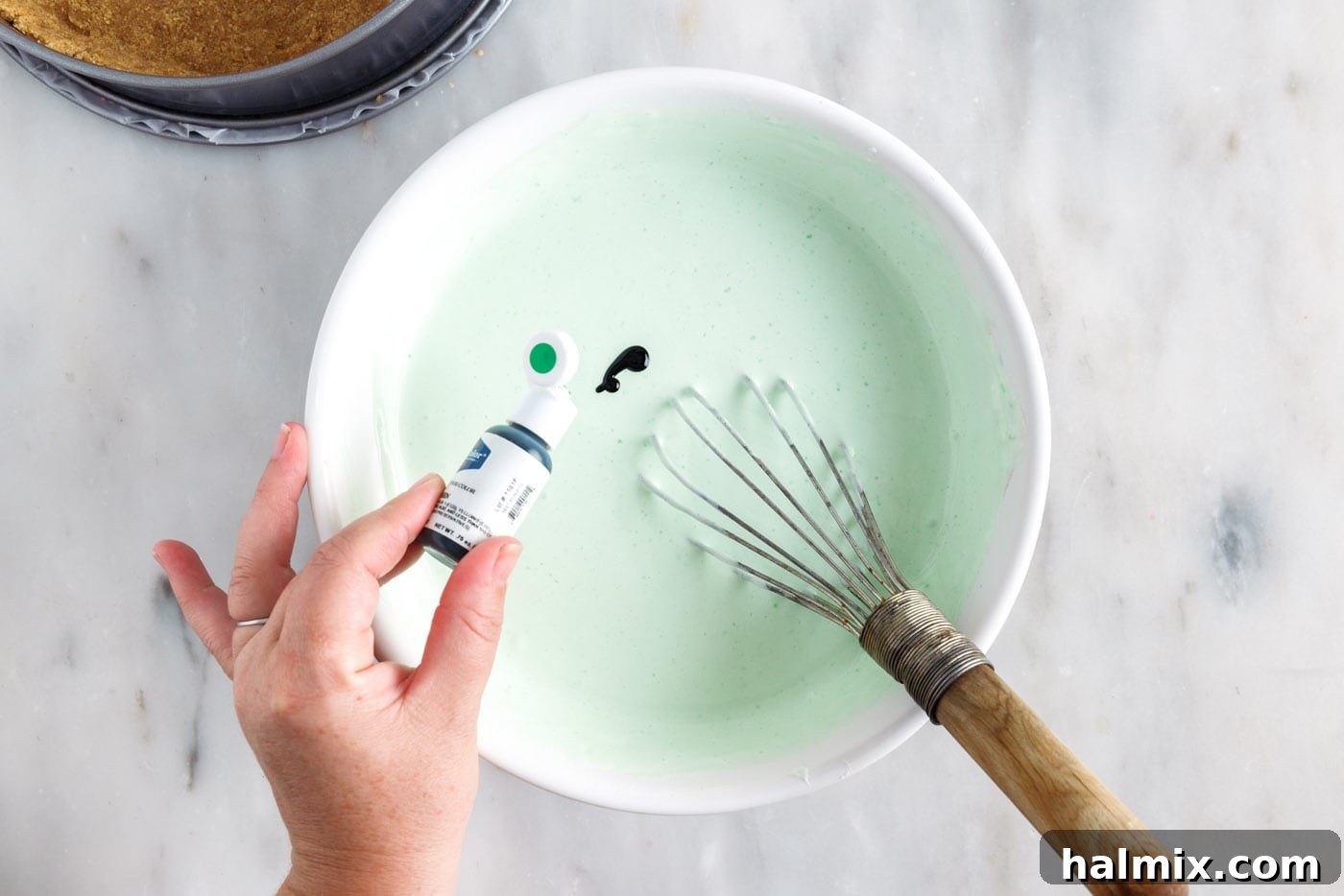 Rainbow Ripple Gelatin Pie 9 Whisking green gel food coloring into the lime jello and Cool Whip mixture to achieve a desired color.