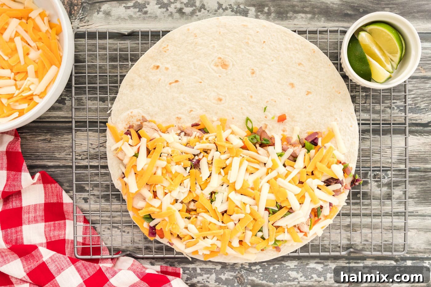 More cheese added on top of the chicken and veggies filling