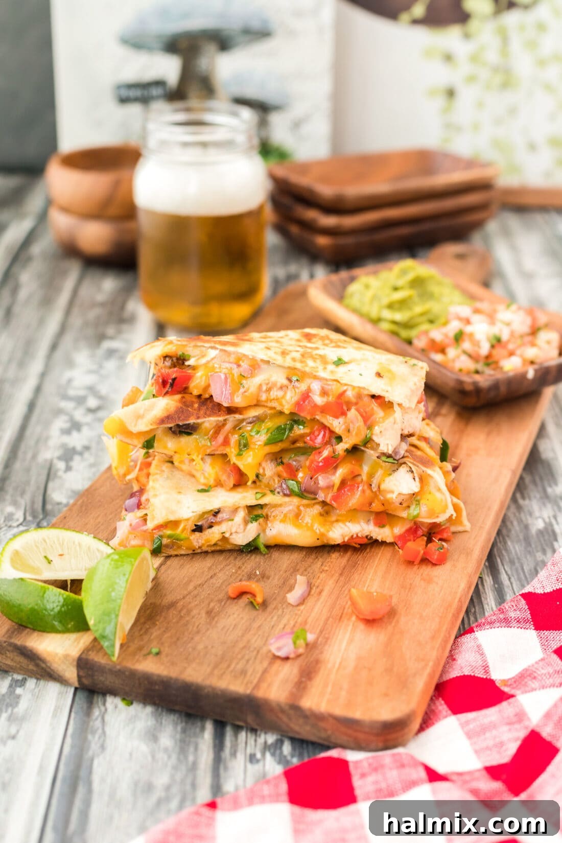 A stack of perfectly cooked chicken quesadillas, cut into triangles