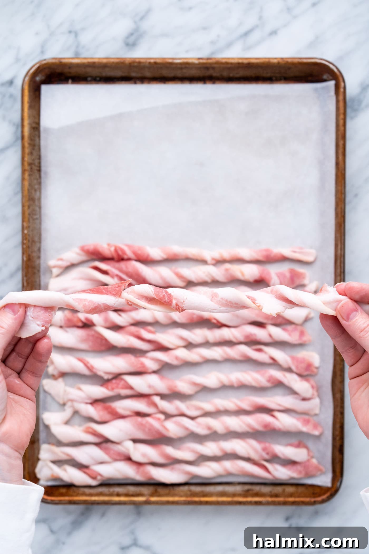 Caramelized Bacon Bites 6 twisted bacon over a baking tray