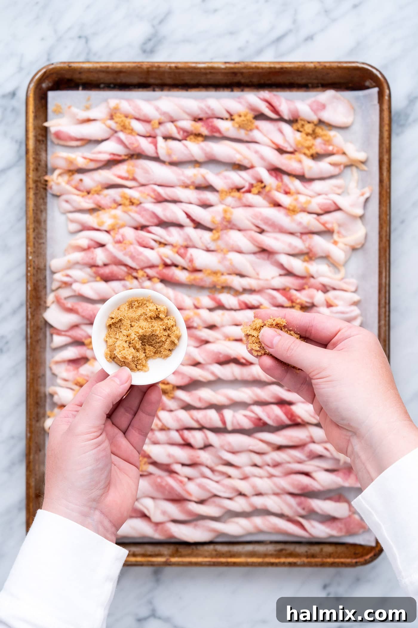 Caramelized Bacon Bites 7 sprinkling brown sugar over twisted bacon