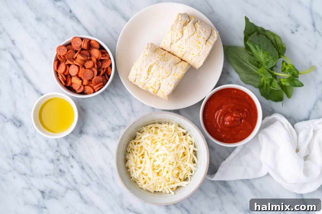 Pizza Zingers 4 Ingredients for pizza bites laid out: biscuit dough, mini pepperonis, mozzarella cheese, and fresh basil.