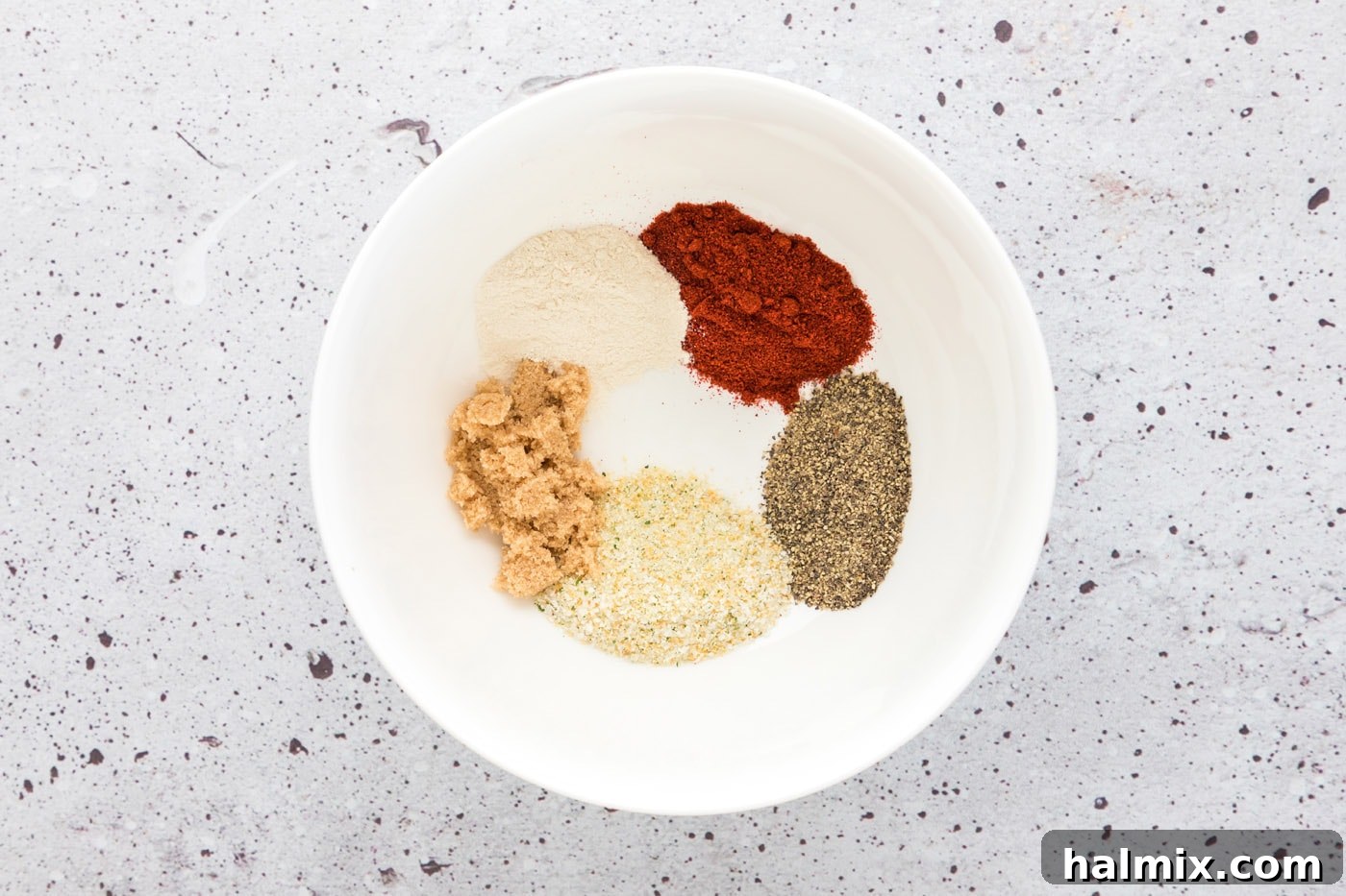 Crispy Golden Baked Chicken Thighs 5 seasoning rub for chicken in a bowl