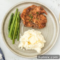 Plated Fried Pork Chops with a crispy golden coating