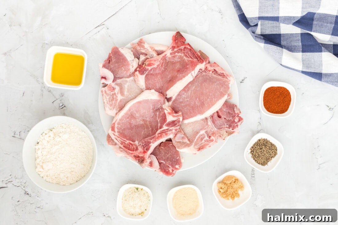 Assortment of Fresh Ingredients for Pan-Fried Pork Chops including pork, spices, flour, and oil