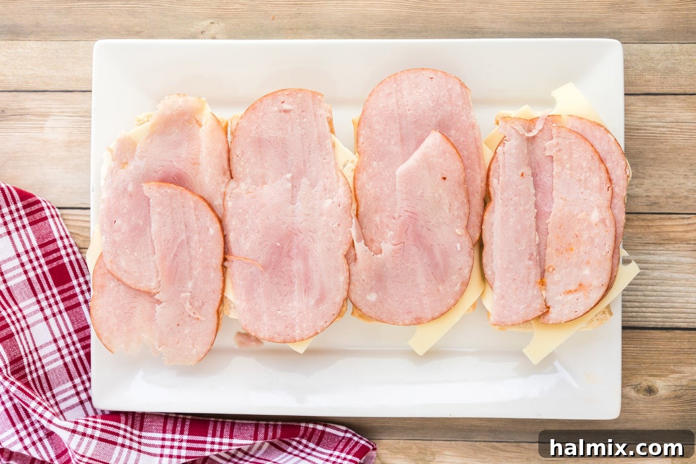 ham on top of Swiss cheese and Cuban bread