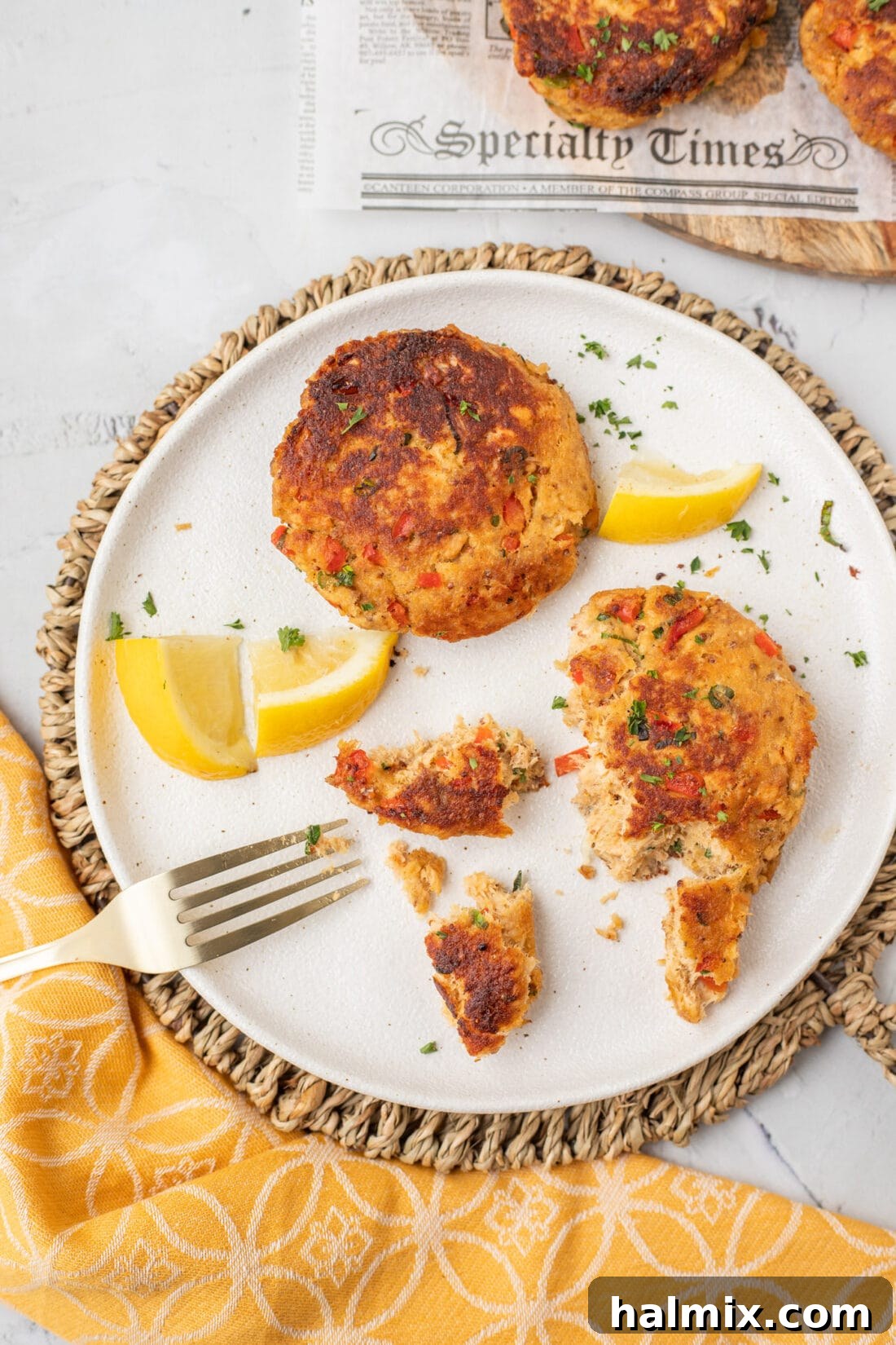 A beautifully arranged plate of freshly cooked salmon croquettes, garnished and ready to be enjoyed as a meal.