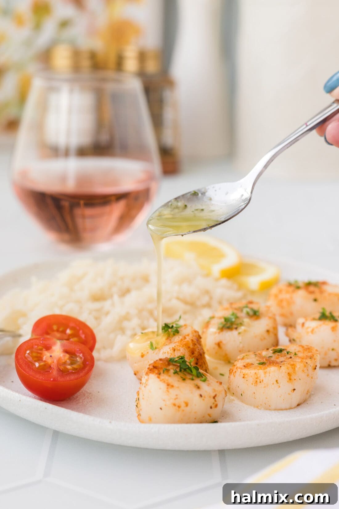 Buttery Air Fryer Scallops being drizzled with garlic butter