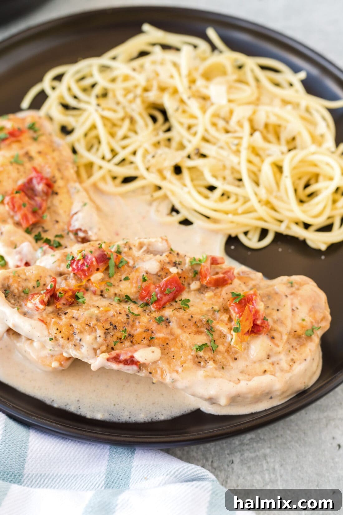 Plated Marry Me Chicken with spaghetti, ready to enjoy.