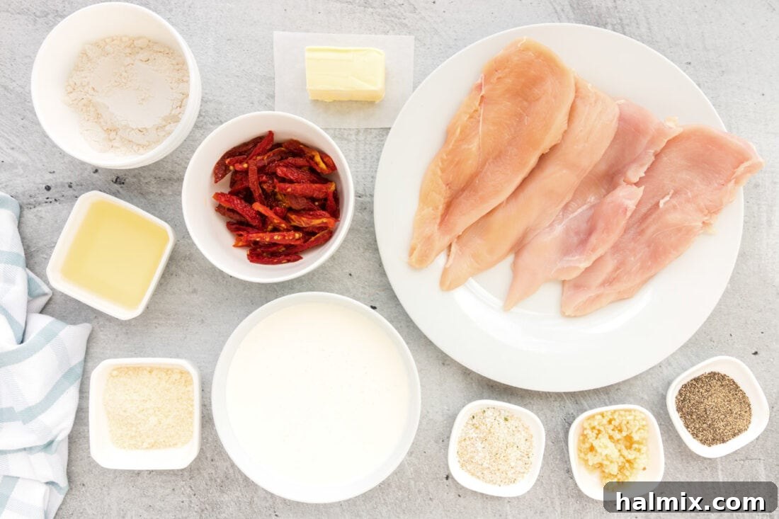 Array of fresh ingredients for Marry Me Chicken laid out on a kitchen counter.