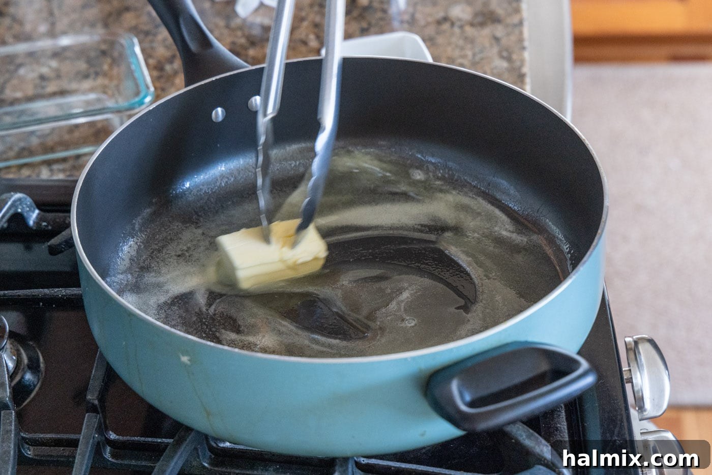 Melting butter and olive oil in a hot skillet.