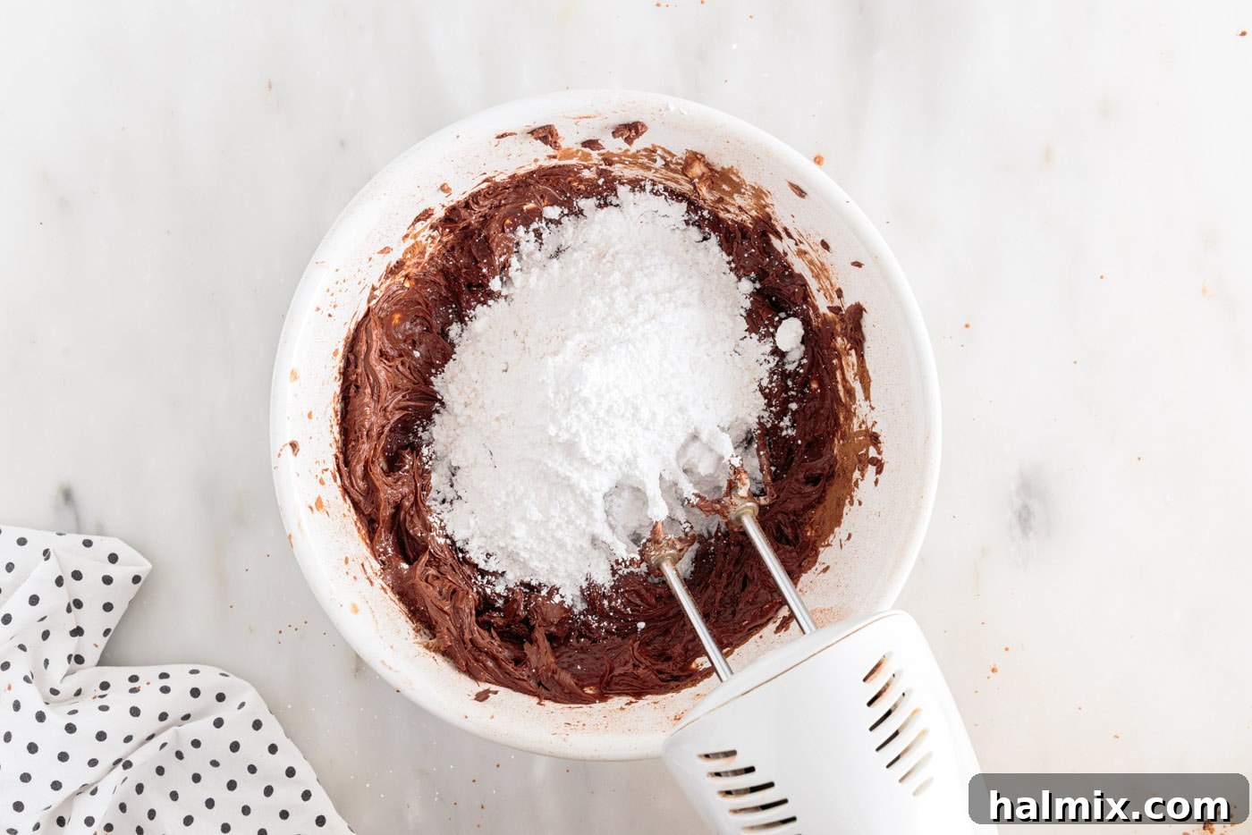 powdered sugar added to chocolate frosting