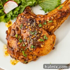 Beautifully plated Veal Chop on a white plate, highlighting its tender texture and golden crust.