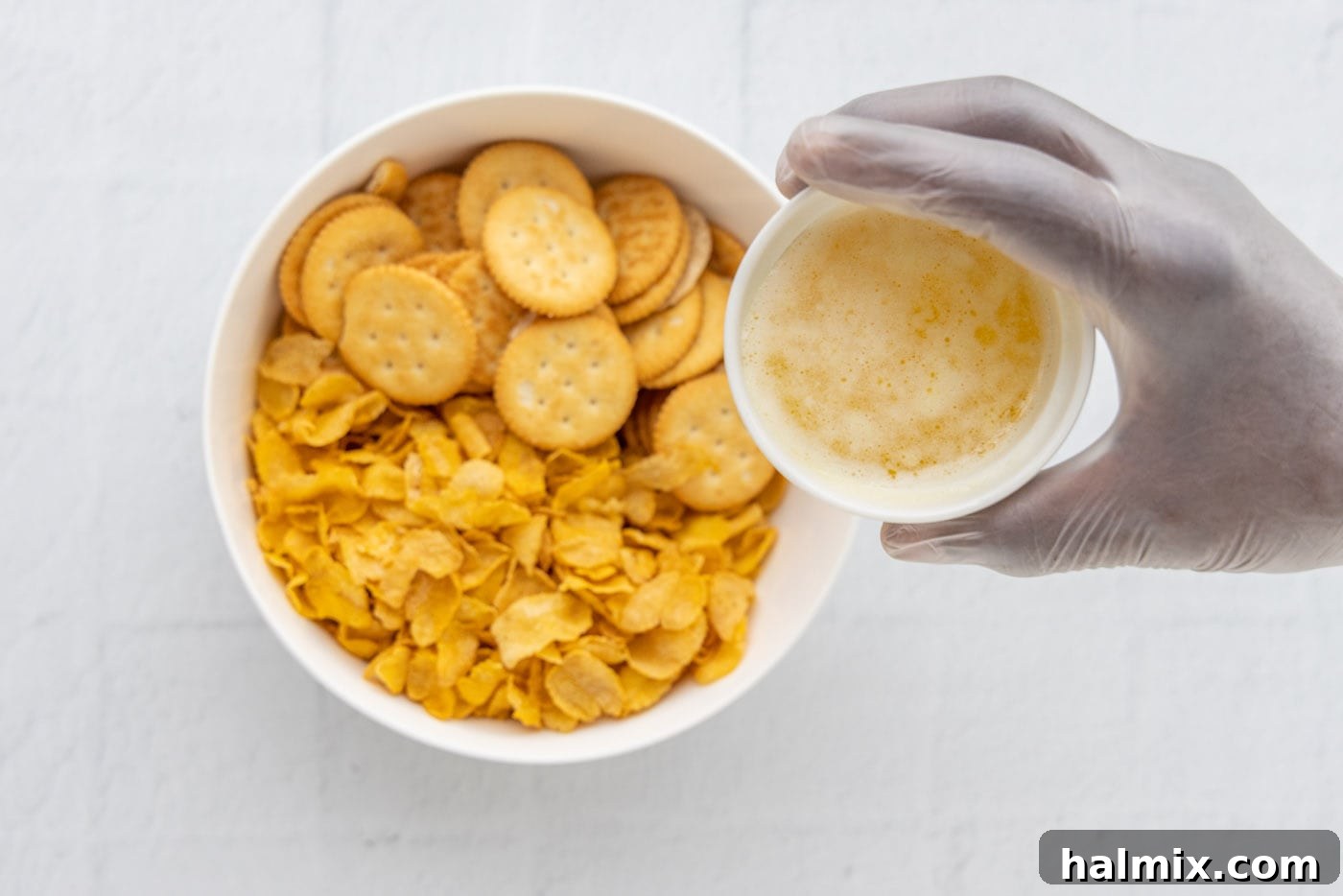 Comfort Potato Bake 12 ritz crackers and cornflakes in a bowl with melted butter
