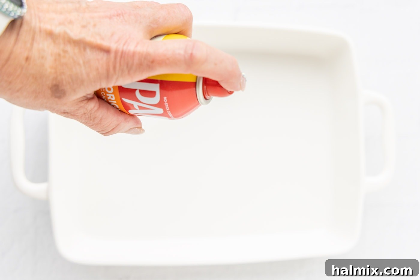 Comfort Potato Bake 5 spraying baking pan with non stick spray