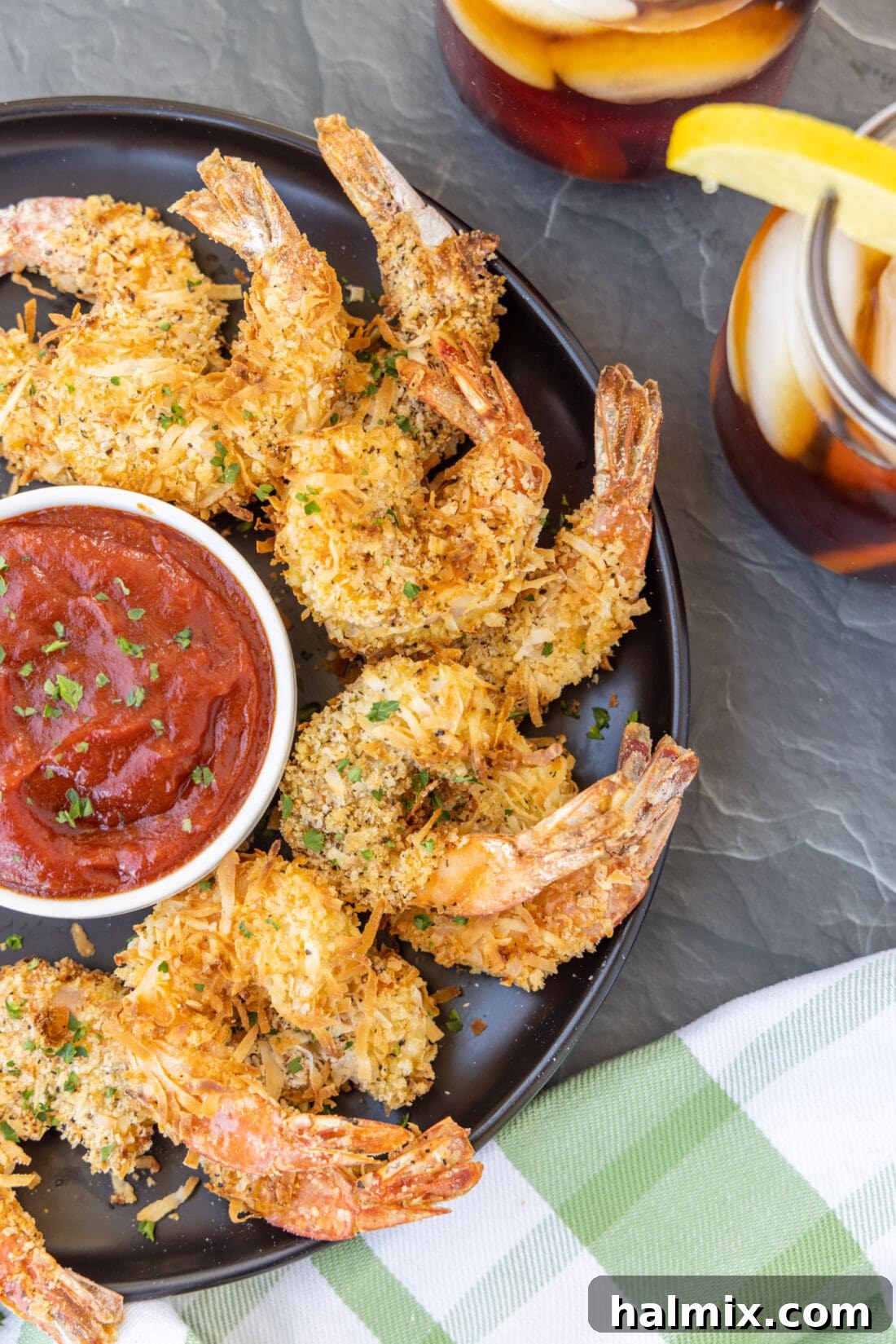 Air Fryer Coconut Shrimp on plate with sauce