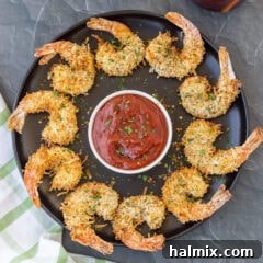 Air Fryer Coconut Shrimp on black plate