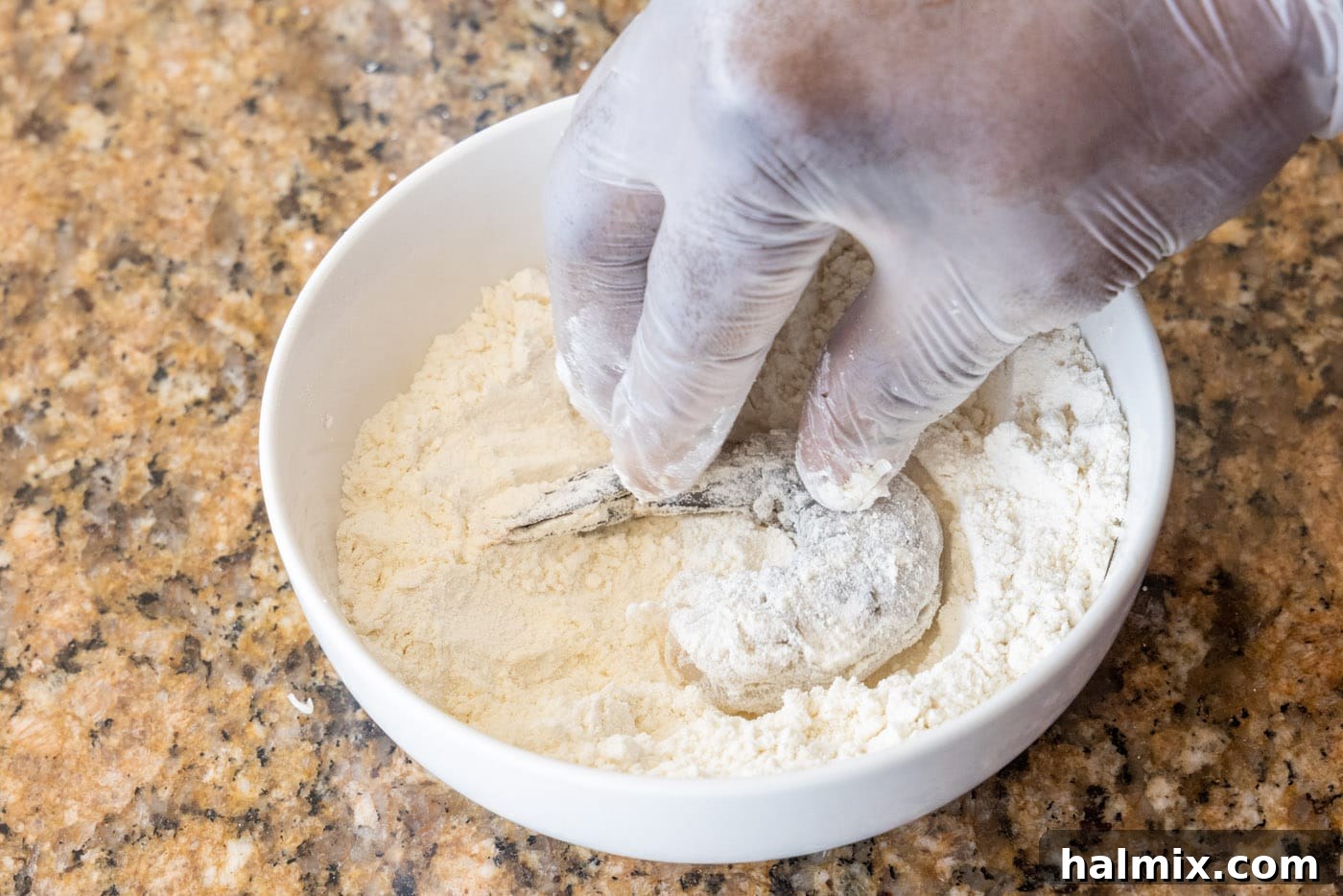 dipping shrimp into flour