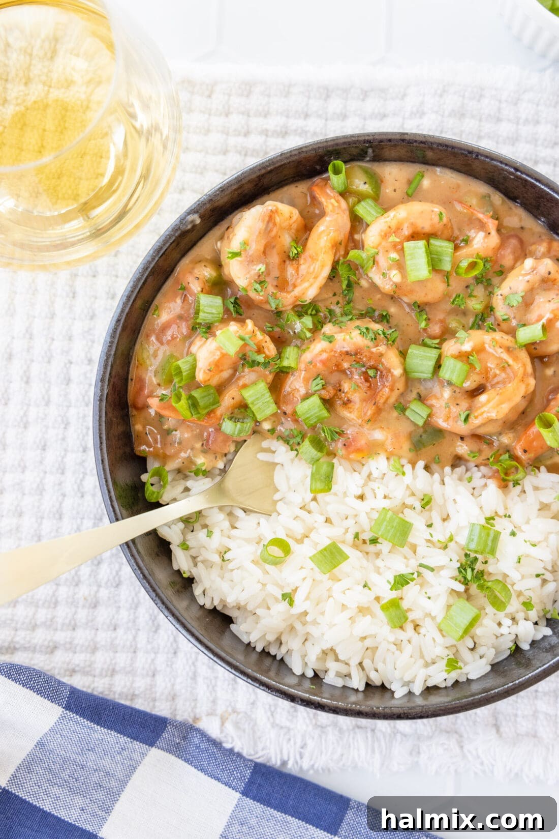 Shrimp Etouffee served in a bowl with fluffy white rice, ready to eat.