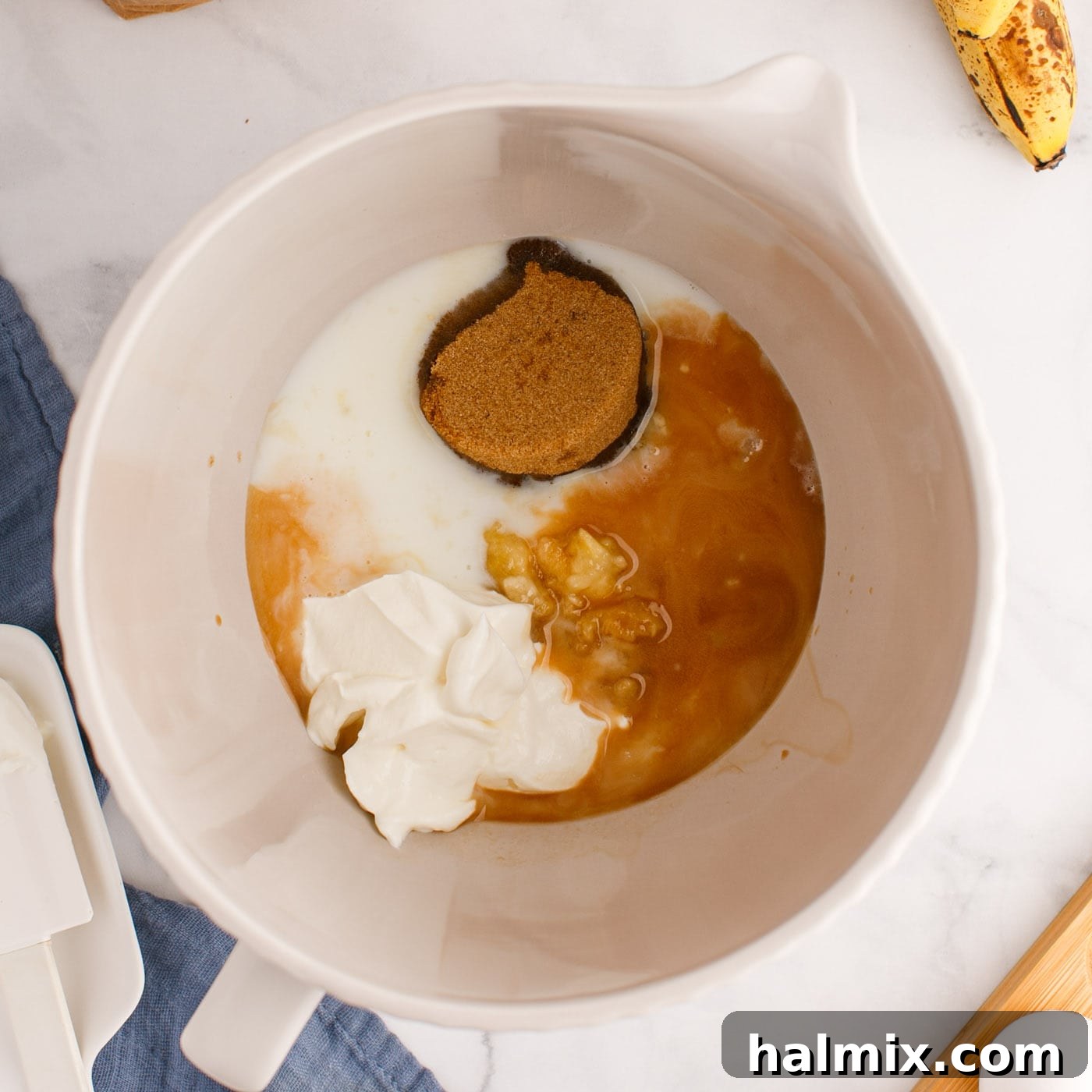 ingredients for chocolate chip banana muffins in a bowl