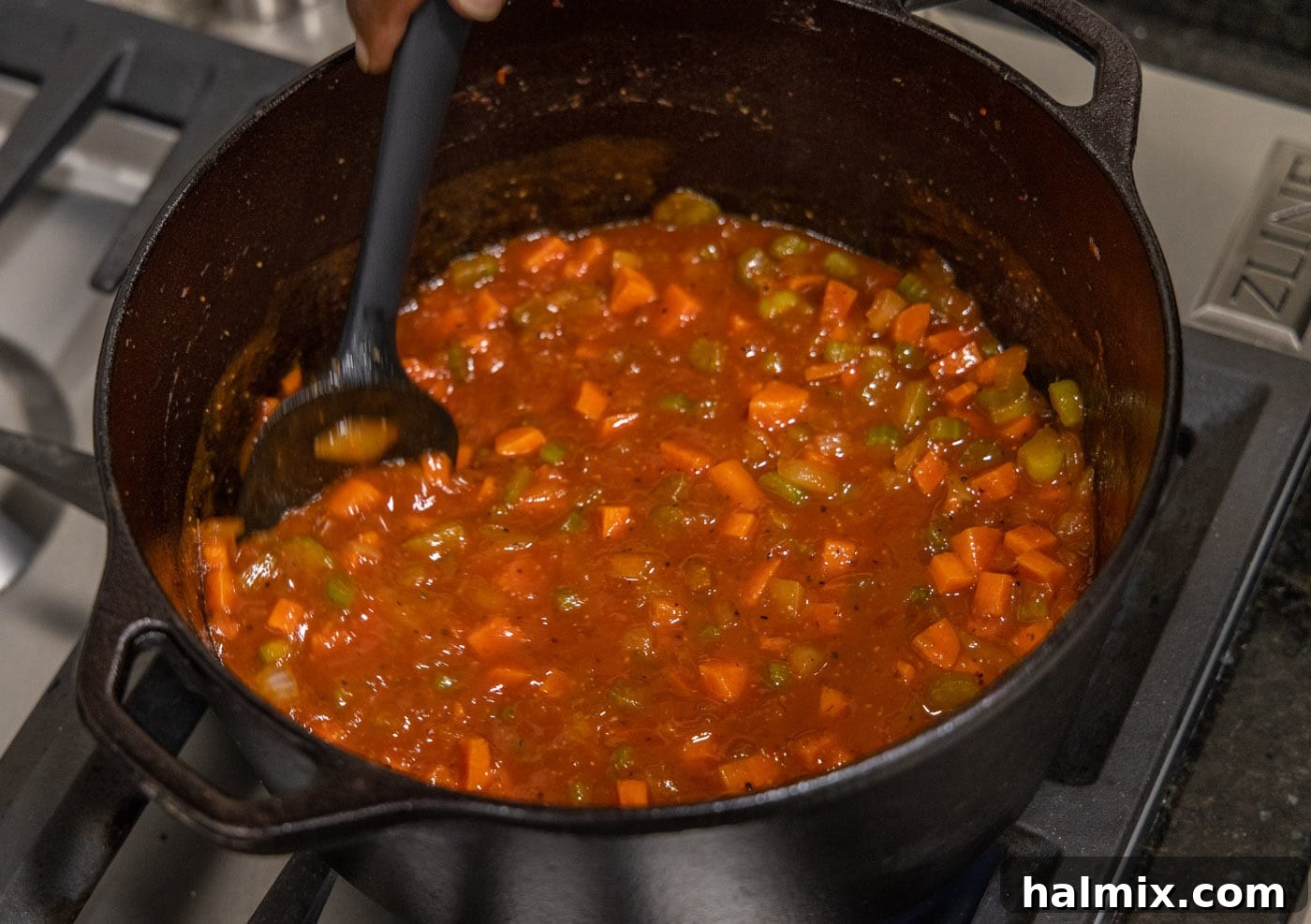 Meltingly Tender Veal Osso Buco 13 stirring veal osso buco in dutch oven