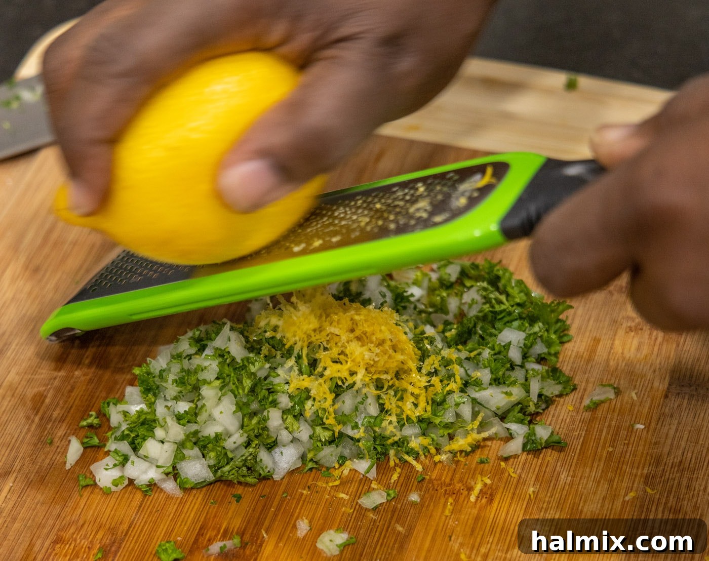 Meltingly Tender Veal Osso Buco 16 grating lemon over onion and parsley