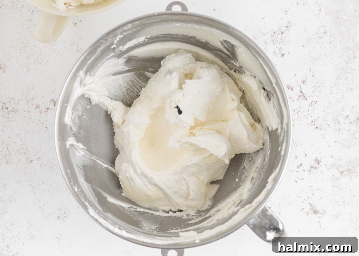Vanilla buttercream frosting in a mixing bowl