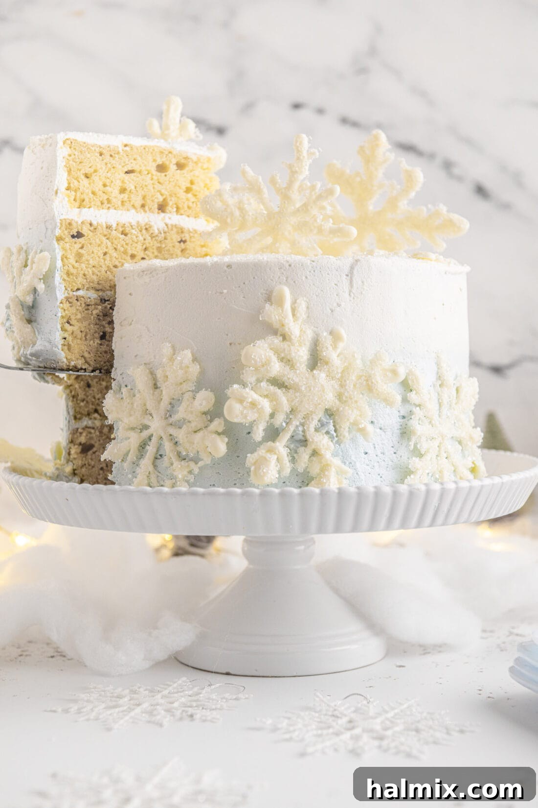 Removing a slice of Snowflake Cake, revealing the ombre layers