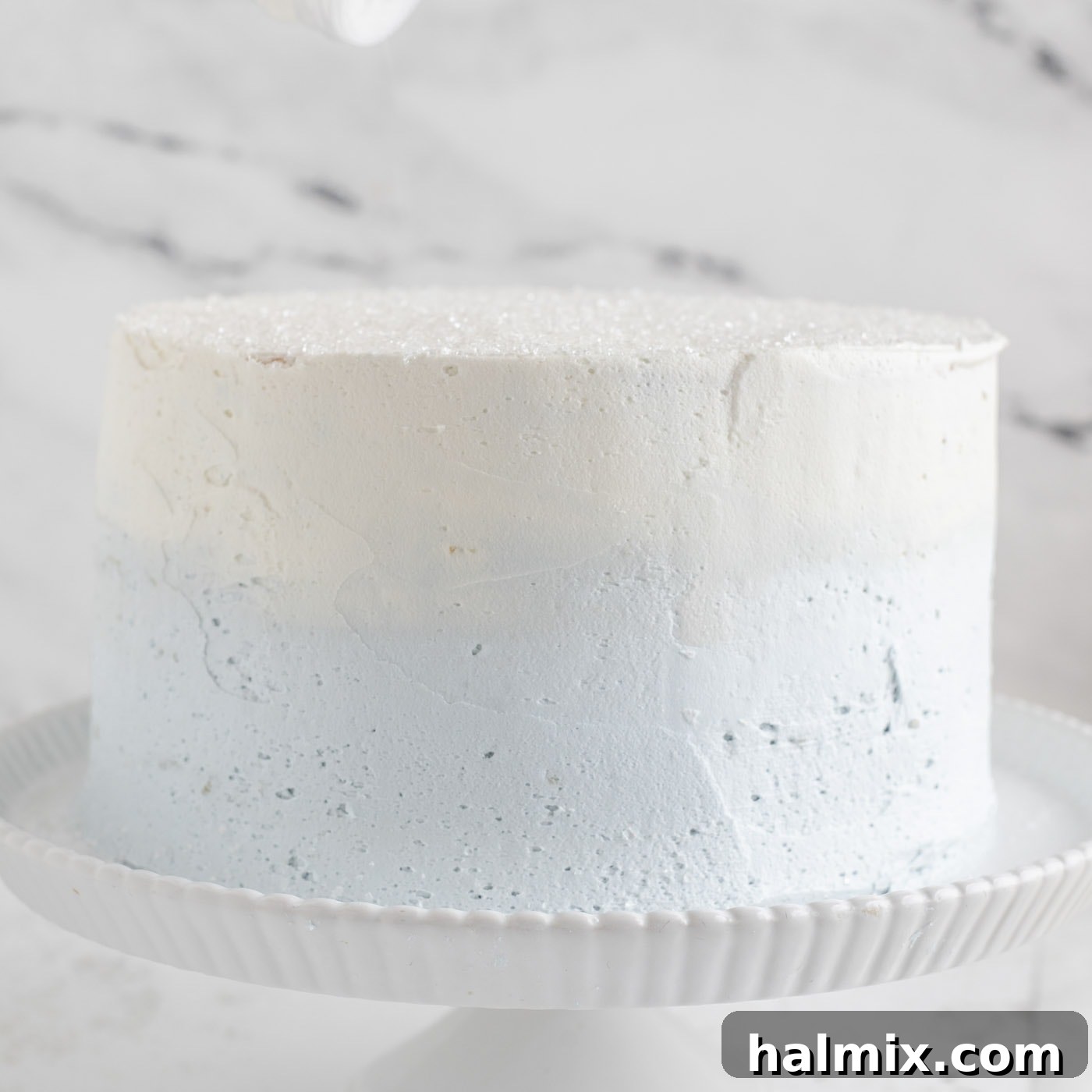 Fully frosted snowflake cake with sugar crystals