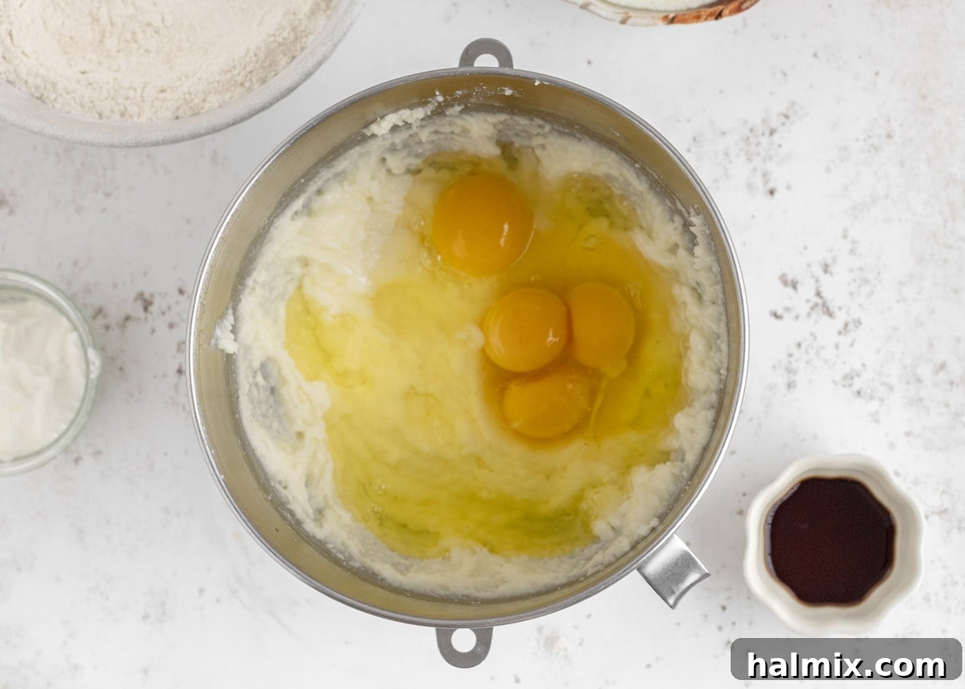 Eggs added to the cake batter in a stand mixer