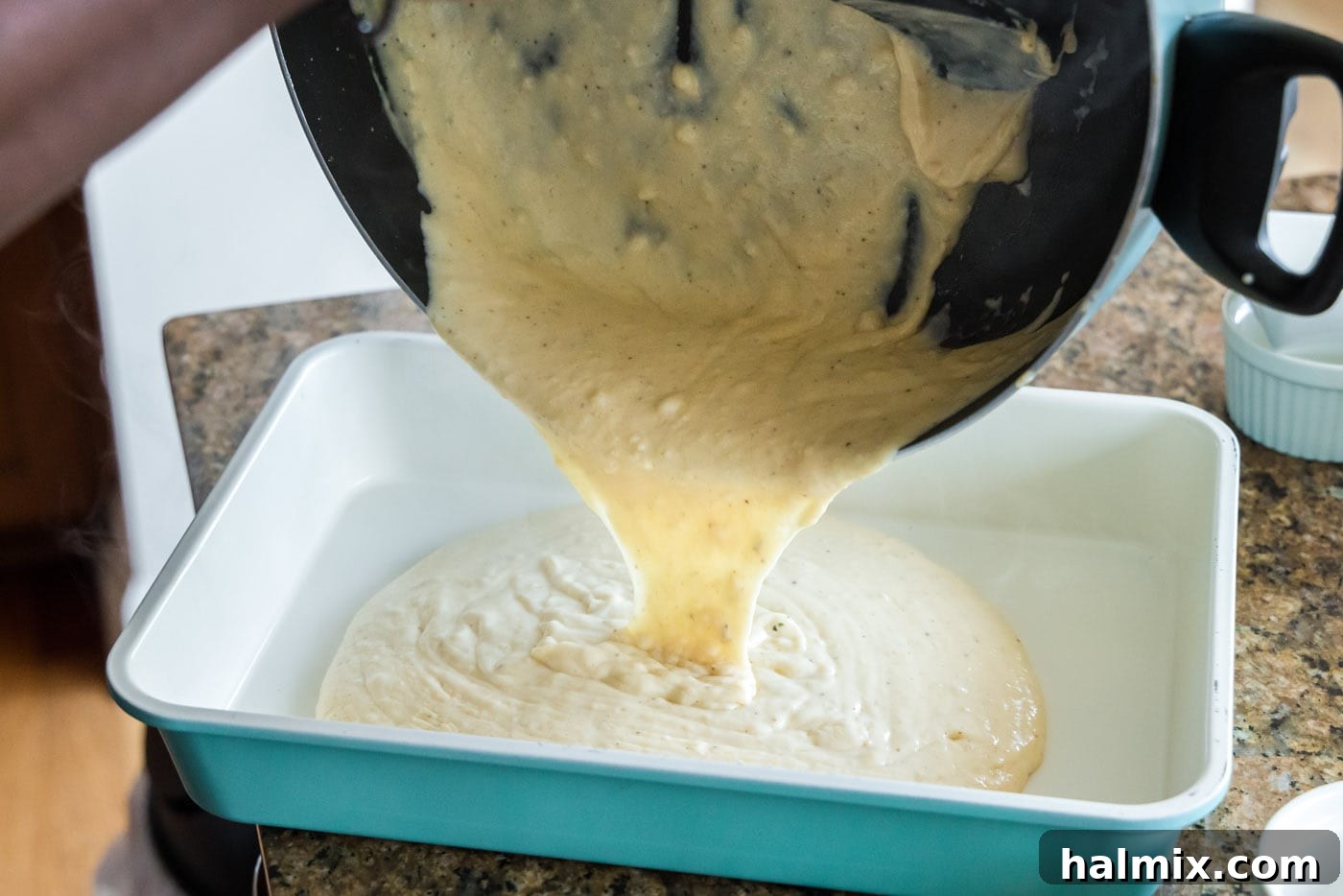 Fisherman's Lasagna 15 Spreading a layer of creamy seafood sauce on the bottom of a 13x9 baking dish.