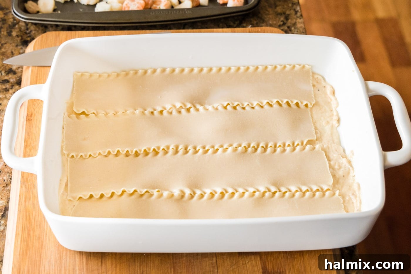 Fisherman's Lasagna 16 A layer of soaked lasagna noodles neatly placed over the sauce in the baking dish.