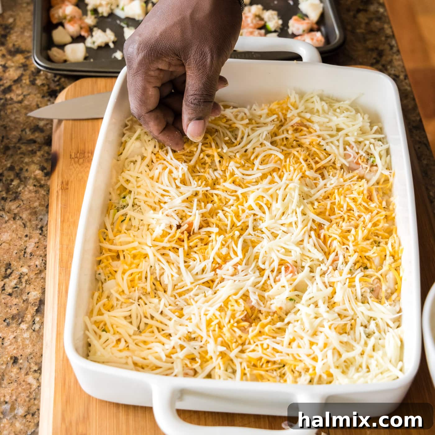 Fisherman's Lasagna 19 Sprinkling shredded Colby Jack and mozzarella cheese over the seafood layer.
