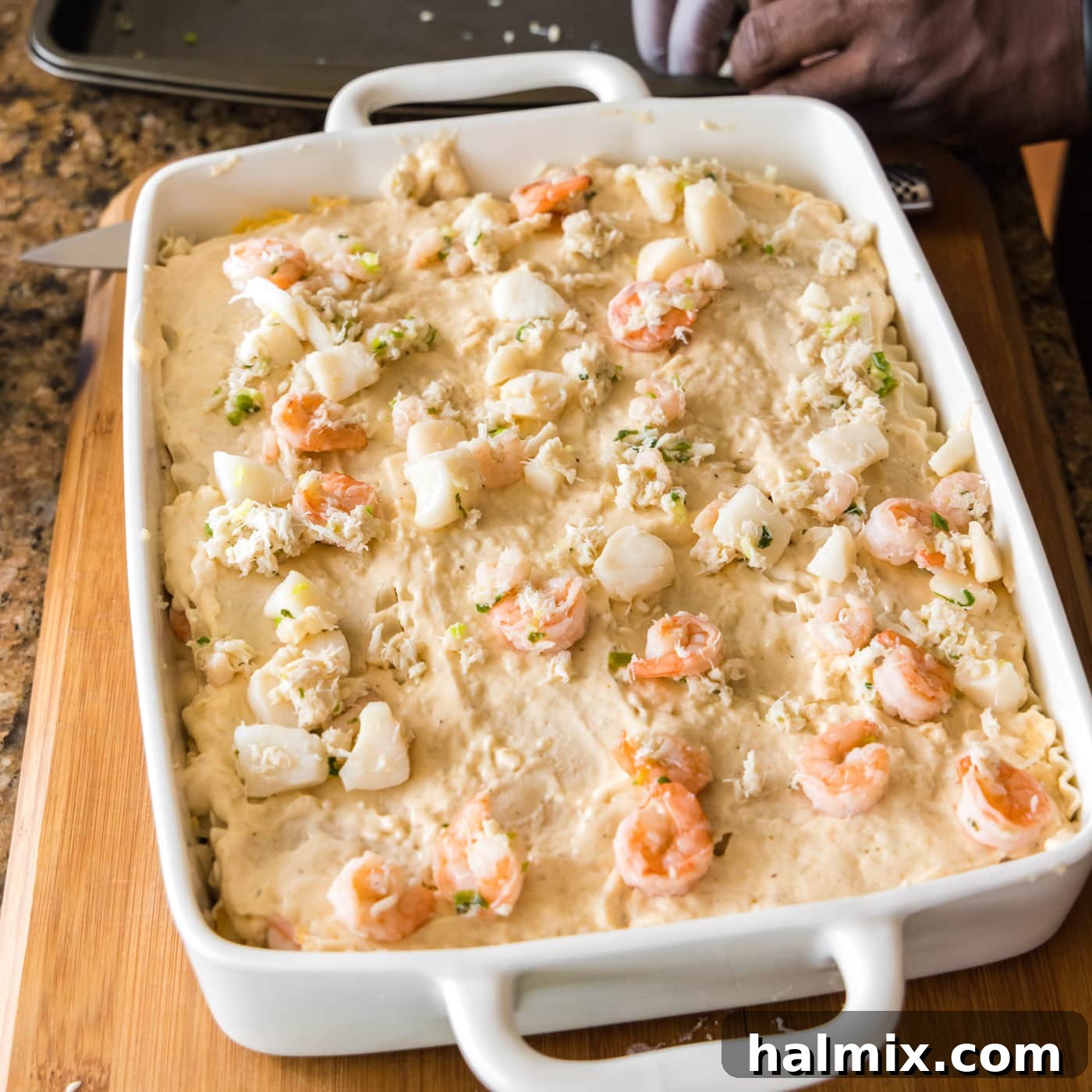 Fisherman's Lasagna 21 A fully layered seafood lasagna, showing all its rich ingredients before baking.
