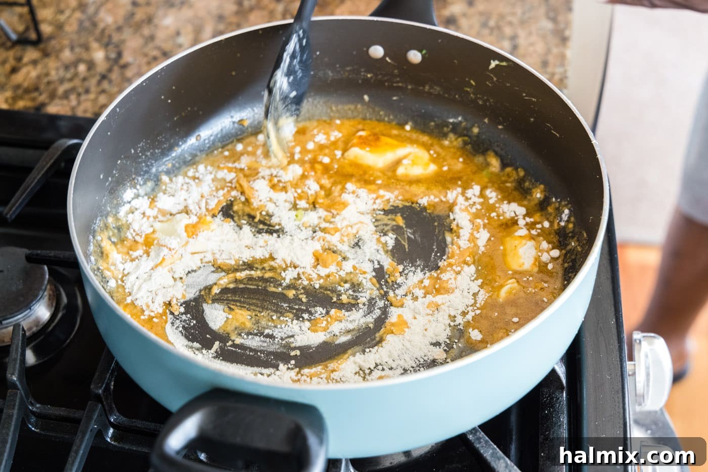 Fisherman's Lasagna 10 Mixing flour and butter in a skillet to create a roux, which will thicken the sauce.