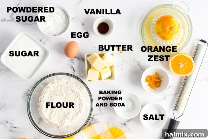 Essential ingredients for baking Orange Crinkle Cookies, featuring orange juice and zest for authentic flavor. Precisely measured ingredients for making orange crinkle cookies laid out on a countertop, including flour, butter, sugar, and fresh oranges.