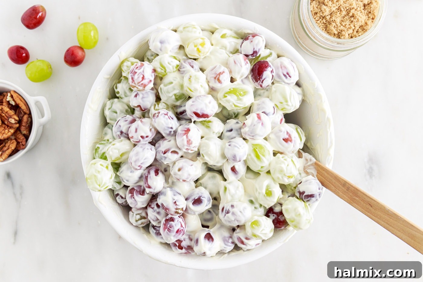creamy grape salad fully mixed in a bowl