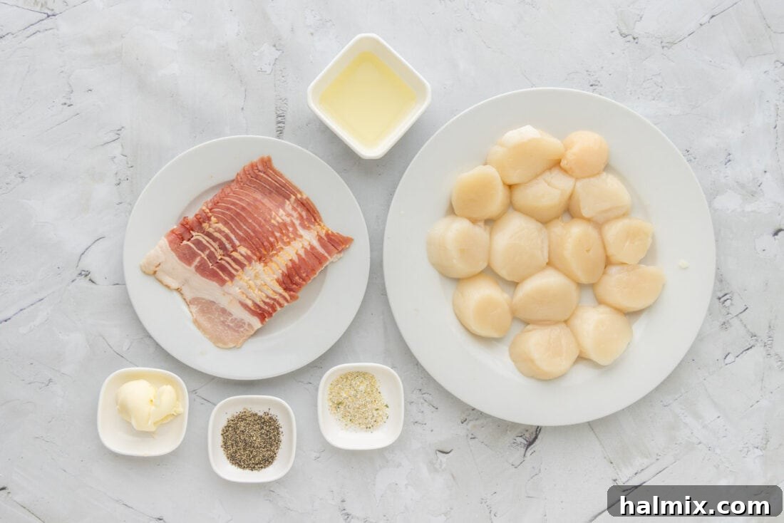 A selection of fresh ingredients laid out on a kitchen counter: sea scallops, strips of bacon, olive oil, garlic salt, black pepper, and a pat of butter.