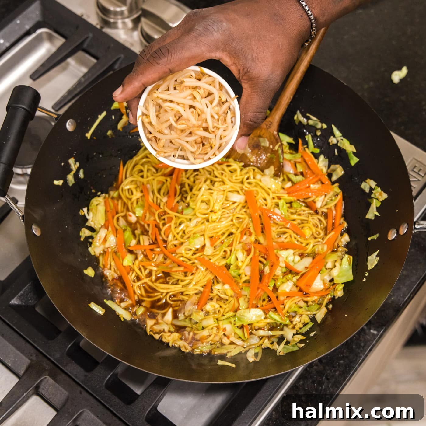 Adding bean sprouts to chow mein