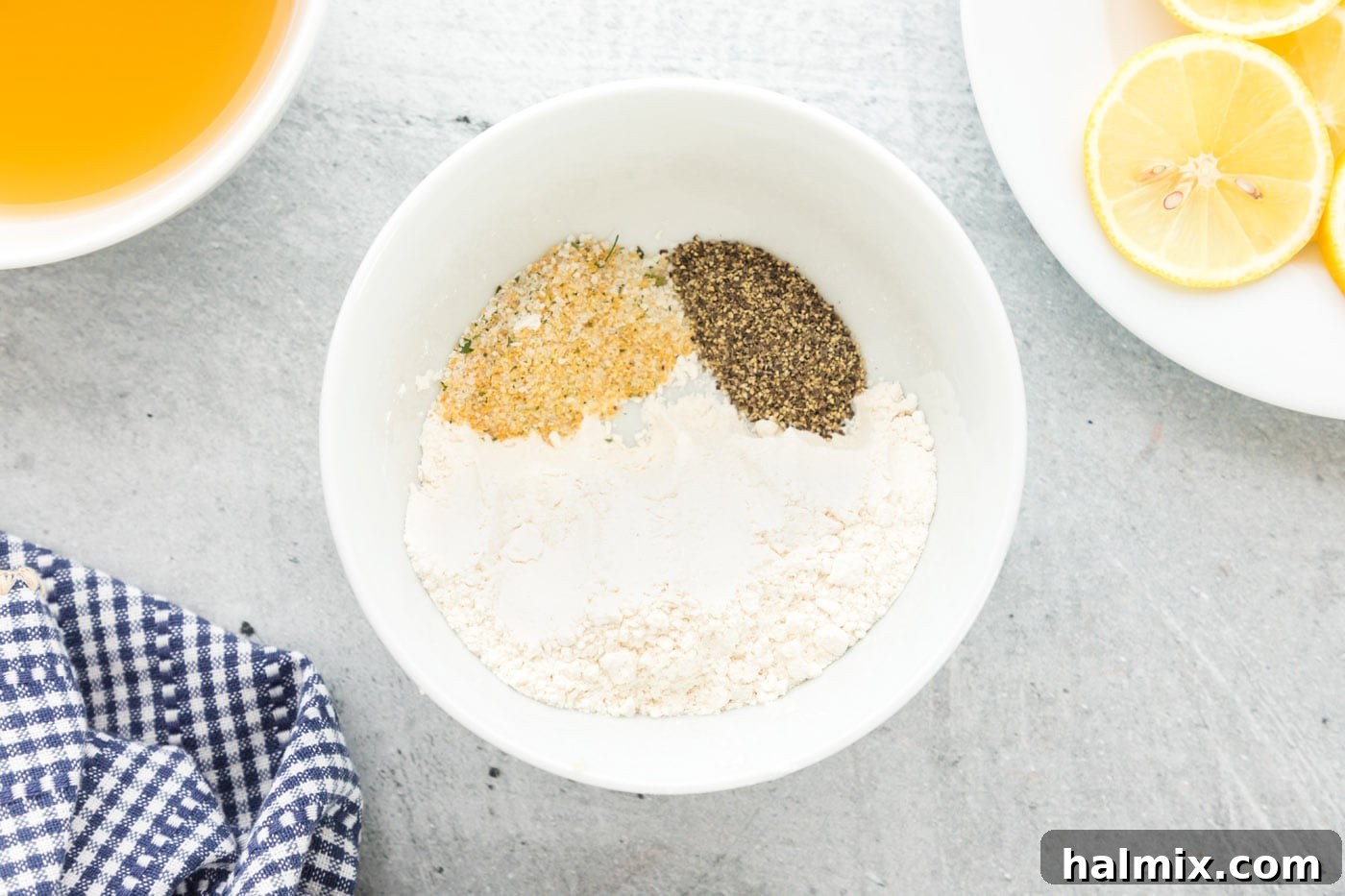 Seasoned Flour for Dredging Flour mixture in a bowl, ready for dredging chicken