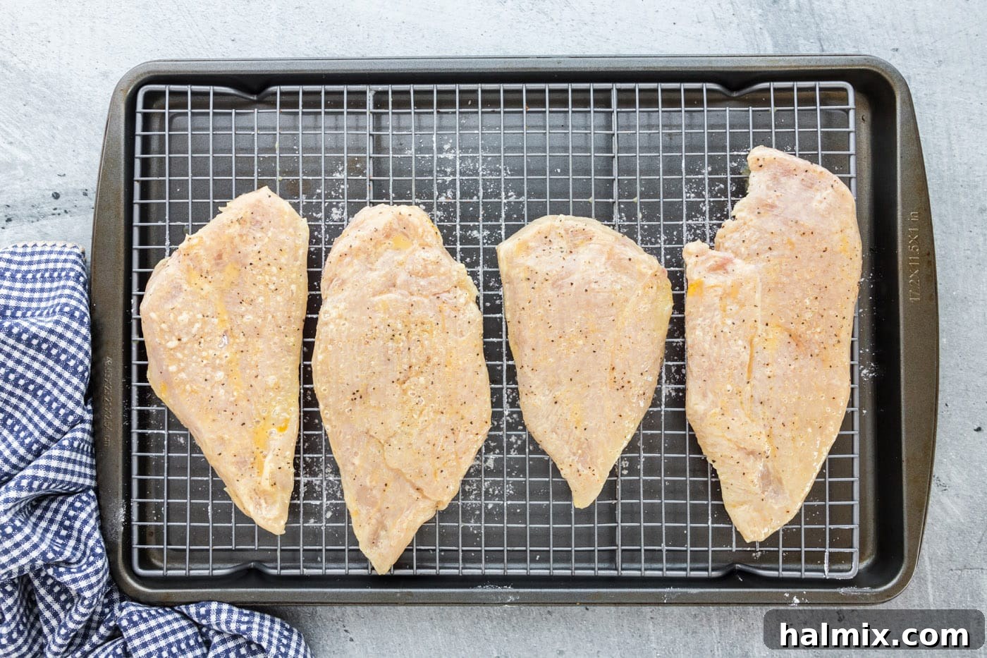 Flour and Egg Coated Chicken Chicken breasts coated in both flour and egg wash, ready for frying