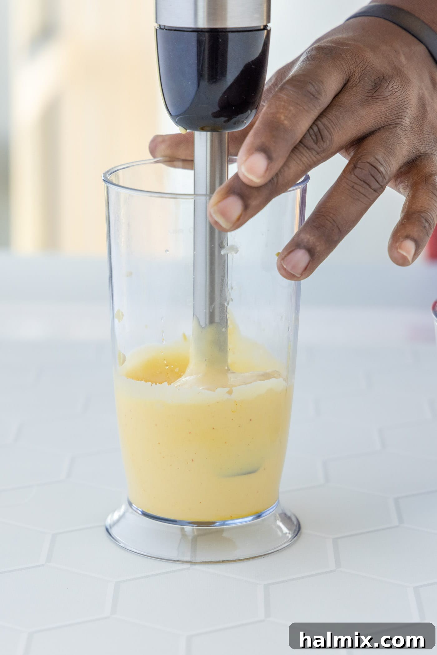 Velvety Hollandaise Sauce 7 blending hollandaise sauce with an immersion blender